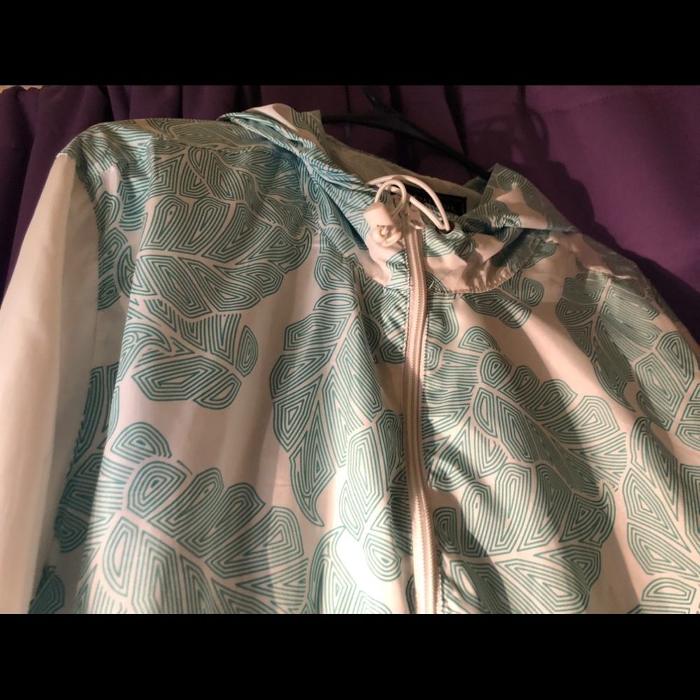 White and teal floral windbreaker